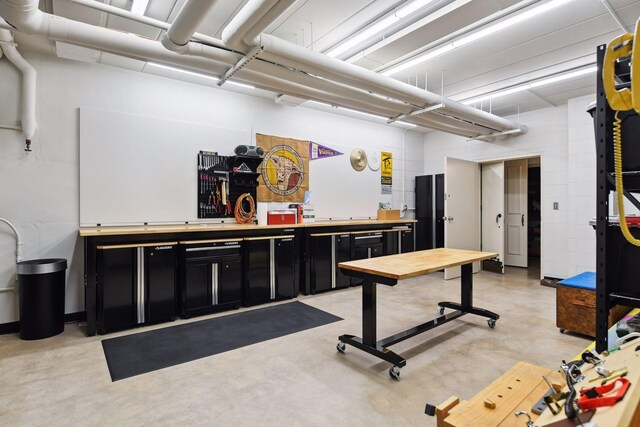 1150 Wyndmere Rd, Orono, MN 55391 - miscellaneous room featuring concrete flooring and a community bar