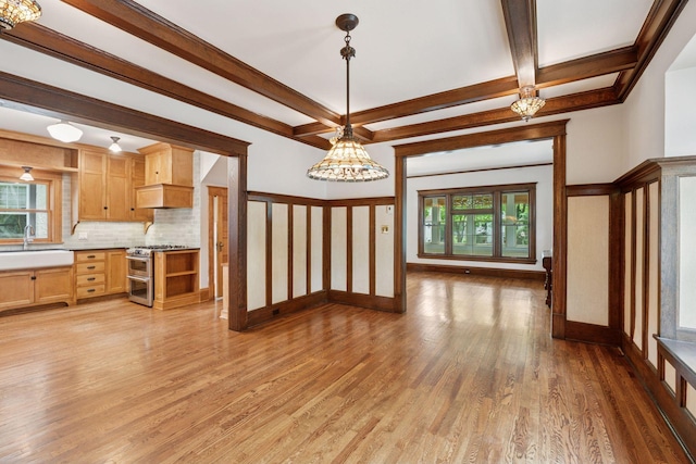 3252 Aldrich Ave S, Minneapolis, MN 55408 - kitchen featuring range with two ovens, light wood-style flooring, light brown cabinets, tasteful backsplash, and a chandelier