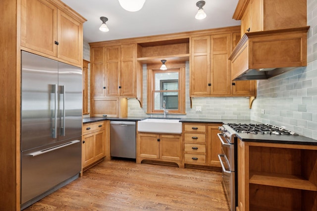 3252 Aldrich Ave S, Minneapolis, MN 55408 - kitchen with stainless steel appliances, open shelves, a sink, dark countertops, and backsplash