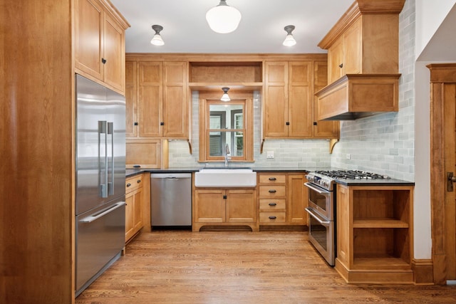 3252 Aldrich Ave S, Minneapolis, MN 55408 - kitchen with appliances with stainless steel finishes, open shelves, a sink, and dark countertops