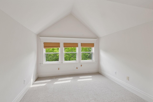3252 Aldrich Ave S, Minneapolis, MN 55408 - carpeted spare room featuring vaulted ceiling and baseboards