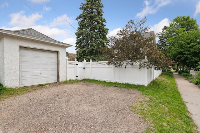 3252 Aldrich Ave S, Minneapolis, MN 55408 - garage featuring a gate and gravel driveway