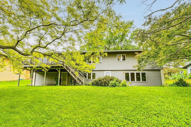 947 Dawn Ave, Shoreview, MN 55126 - back of property with a wooden deck, stairs, and a lawn