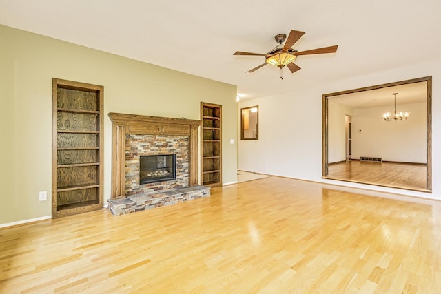 947 Dawn Ave, Shoreview, MN 55126 - unfurnished living room with wood finished floors, ceiling fan, built in features, and baseboards
