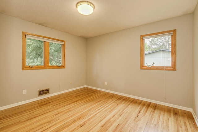 947 Dawn Ave, Shoreview, MN 55126 - spare room with wood finished floors and baseboards