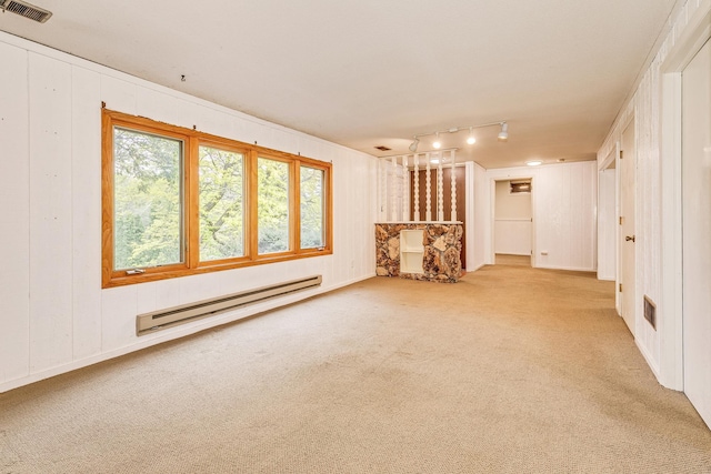 947 Dawn Ave, Shoreview, MN 55126 - carpeted empty room with baseboard heating and track lighting