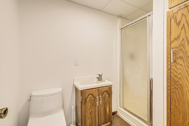 947 Dawn Ave, Shoreview, MN 55126 - bathroom featuring a shower stall, tile patterned flooring, toilet, vanity, and a drop ceiling