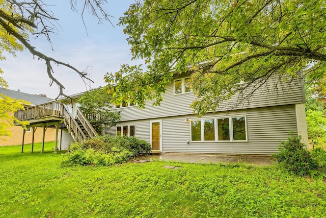 947 Dawn Ave, Shoreview, MN 55126 - rear view of property with a deck, a yard, stairs, and a patio area