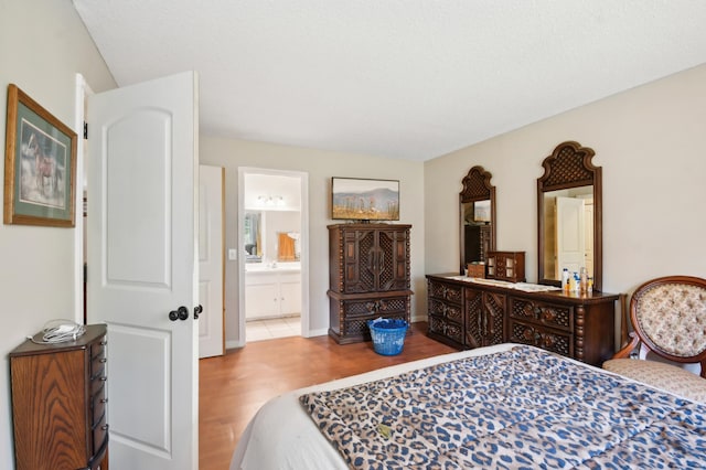 383 Elan Ct, Woodbury, MN 55125 - bedroom with wood finished floors and ensuite bath