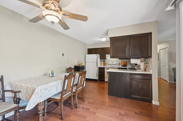 383 Elan Ct, Woodbury, MN 55125 - kitchen with white appliances, dark brown cabinets, light countertops, and wood finished floors