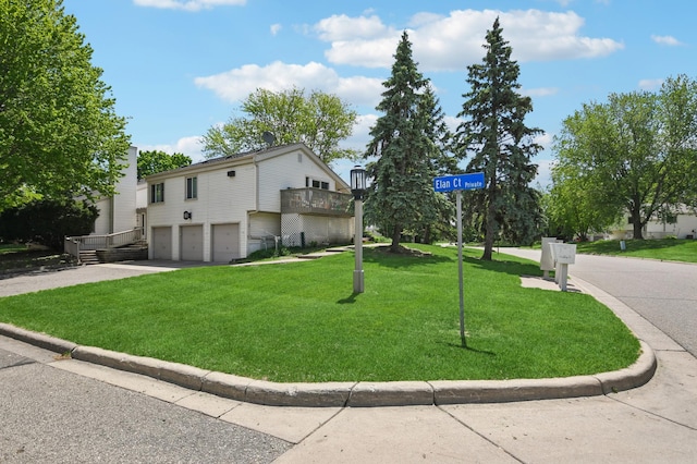 383 Elan Ct, Woodbury, MN 55125 - view of side of property featuring a garage, a yard, and driveway