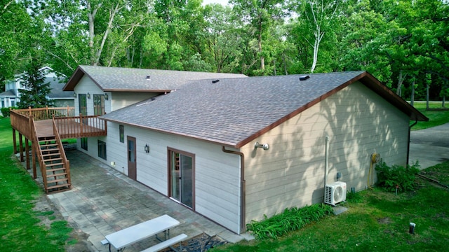 34347 Northview Rd, Everts Twp, MN 56515 - rear view of property featuring roof with shingles, a deck, stairs, a patio, and ac unit