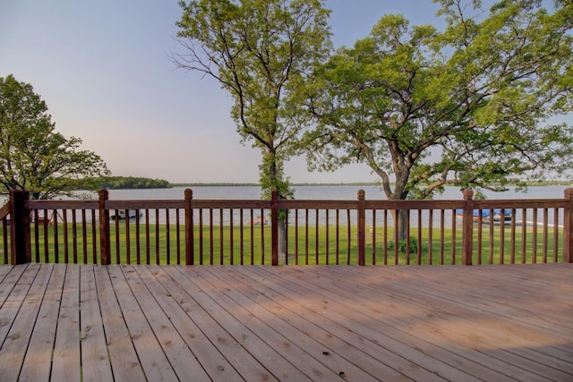 34347 Northview Rd, Everts Twp, MN 56515 - deck at dusk featuring a water view and a lawn