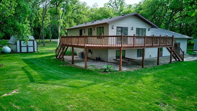 34347 Northview Rd, Everts Twp, MN 56515 - back of property featuring stairs, a wooden deck, central AC, and a yard