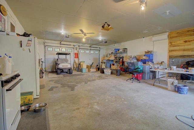 34347 Northview Rd, Everts Twp, MN 56515 - garage with a ceiling fan, a wall mounted AC, and a garage door opener