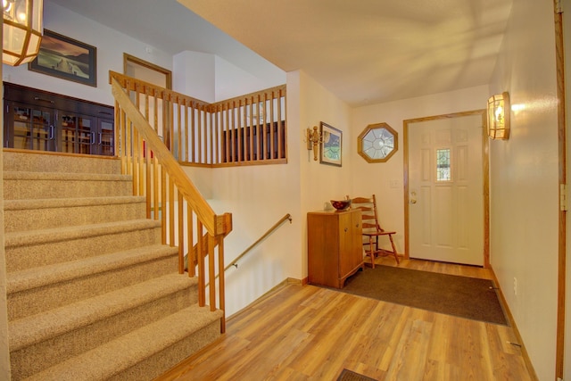 34347 Northview Rd, Everts Twp, MN 56515 - foyer featuring wood finished floors, stairway, and baseboards