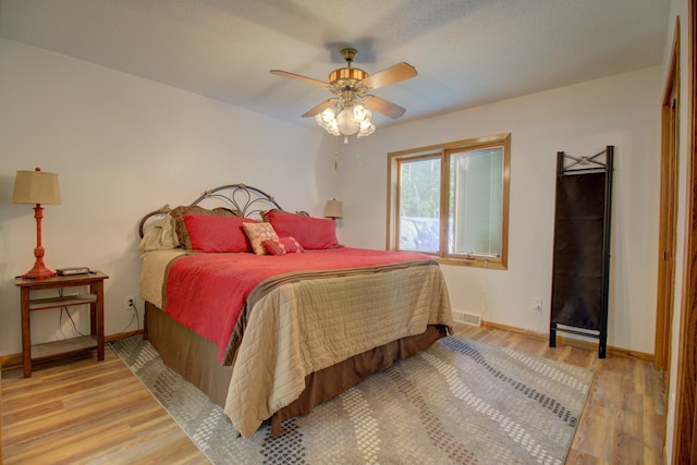 34347 Northview Rd, Everts Twp, MN 56515 - bedroom featuring wood finished floors, baseboards, and ceiling fan