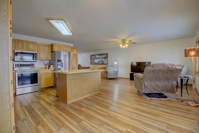 34347 Northview Rd, Everts Twp, MN 56515 - kitchen with stainless steel appliances, light brown cabinets, light countertops, light wood-style flooring, and ceiling fan
