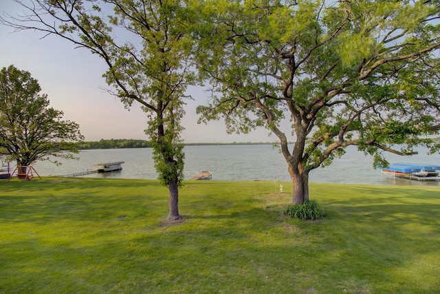 34347 Northview Rd, Everts Twp, MN 56515 - view of grassy yard with a water view and a boat dock