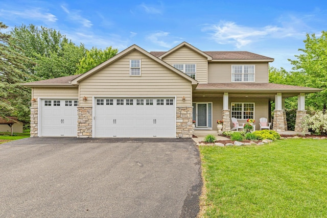 441 Lyman Blvd, Chanhassen, MN 55317 - view of front facade with asphalt driveway, roof with shingles, a porch, and stone siding