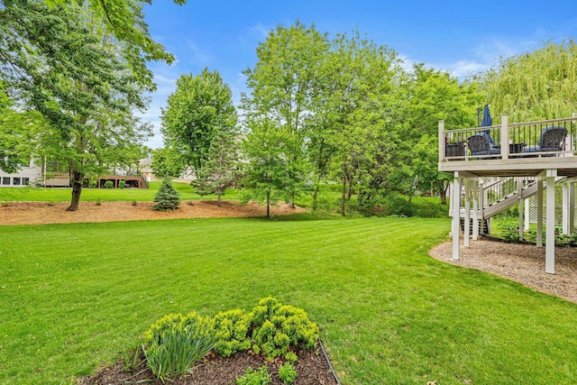 441 Lyman Blvd, Chanhassen, MN 55317 - view of grassy yard featuring a wooden deck and stairs