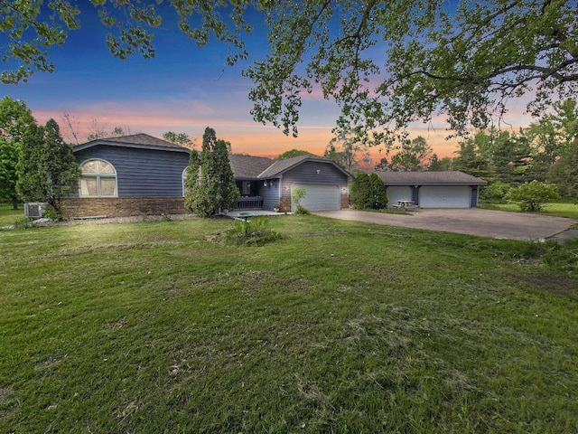 15710 Fox St NW, Andover, MN 55304 - view of front of property featuring a front lawn, cooling unit, driveway, and a detached garage