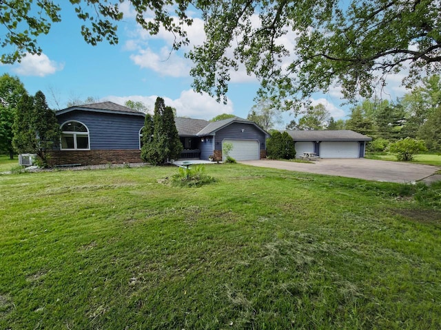 15710 Fox St NW, Andover, MN 55304 - ranch-style home with a front lawn, a garage, central air condition unit, and concrete driveway