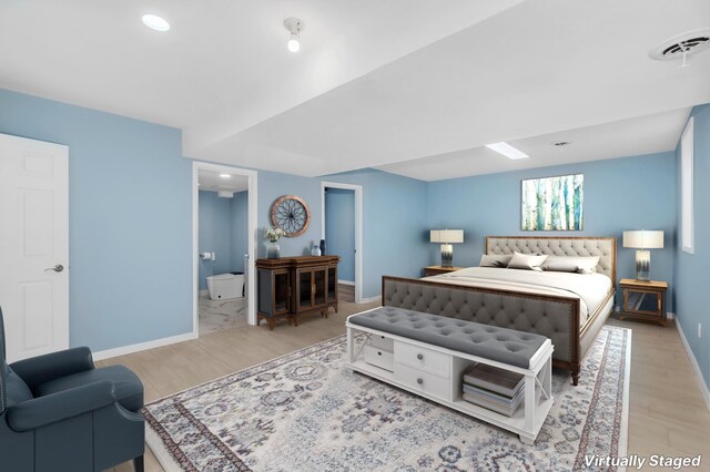 15710 Fox St NW, Andover, MN 55304 - bedroom with light wood-type flooring, baseboards, recessed lighting, and ensuite bathroom