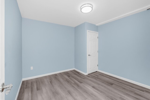 15710 Fox St NW, Andover, MN 55304 - unfurnished room with wood finished floors and baseboards