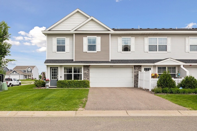 8061 Abercrombie Ln, Woodbury, MN 55129 - multi unit property with driveway, a garage, and stone siding