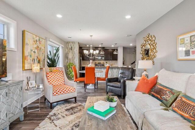 8061 Abercrombie Ln, Woodbury, MN 55129 - living area with a chandelier, wood finished floors, and recessed lighting