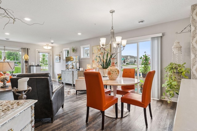 8061 Abercrombie Ln, Woodbury, MN 55129 - dining space with a chandelier, dark wood-style flooring, recessed lighting, and baseboards