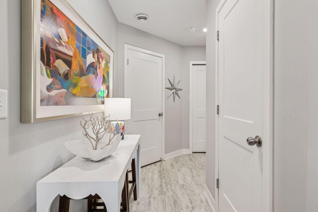 8061 Abercrombie Ln, Woodbury, MN 55129 - hallway with baseboards and light wood-style floors