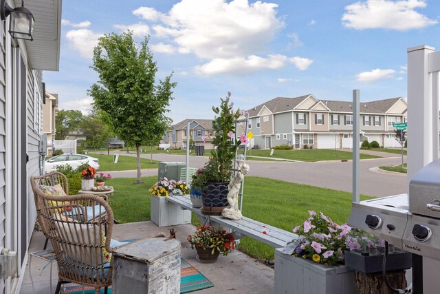 8061 Abercrombie Ln, Woodbury, MN 55129 - porch featuring a residential view and a lawn