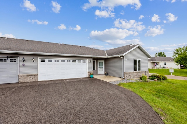 344 Sunfish Ln, Winsted, MN 55395 - ranch-style house featuring brick siding, a front yard, an attached garage, and asphalt driveway