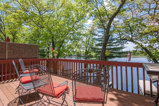 215 Park Dr Unit 4, Balsam Lake, WI 54810 - wooden terrace with a water view and outdoor dining area