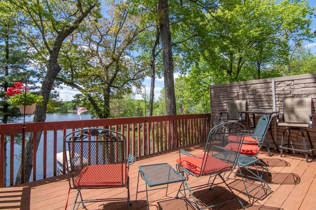 215 Park Dr Unit 4, Balsam Lake, WI 54810 - wooden deck with a water view