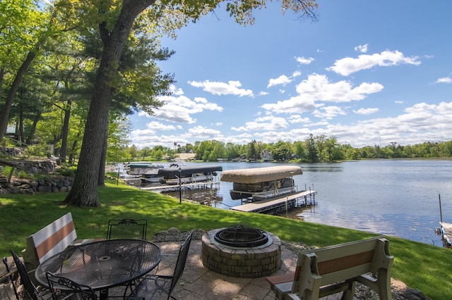 215 Park Dr Unit 4, Balsam Lake, WI 54810 - dock with an outdoor fire pit, boat lift, a yard, and a water view