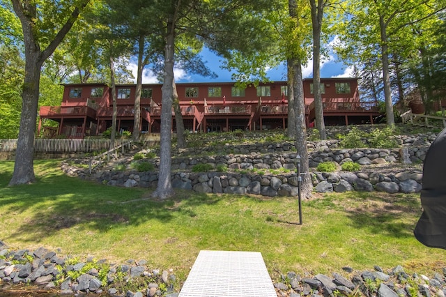215 Park Dr Unit 4, Balsam Lake, WI 54810 - back of house featuring a deck, a lawn, and stairs