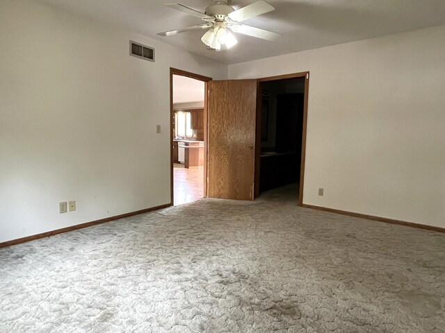 310 8th St, Windom, MN 56101 - carpeted spare room featuring a ceiling fan and baseboards