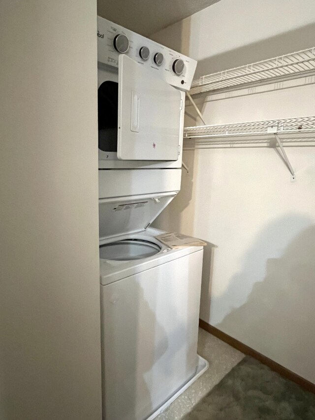 310 8th St, Windom, MN 56101 - laundry area with estacked washer and dryer and baseboards
