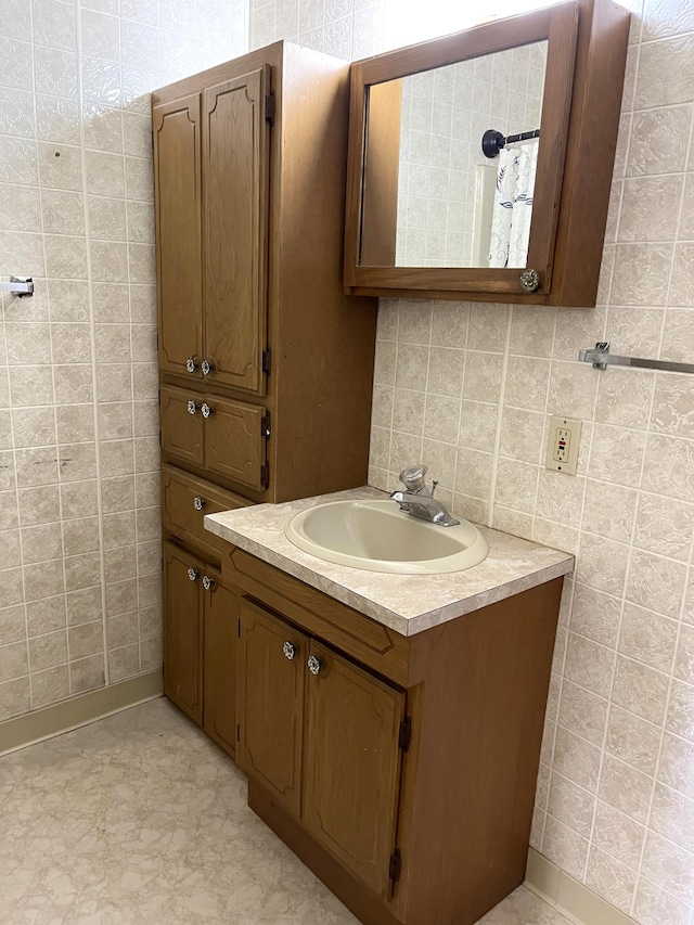 310 8th St, Windom, MN 56101 - bathroom featuring tile walls and vanity