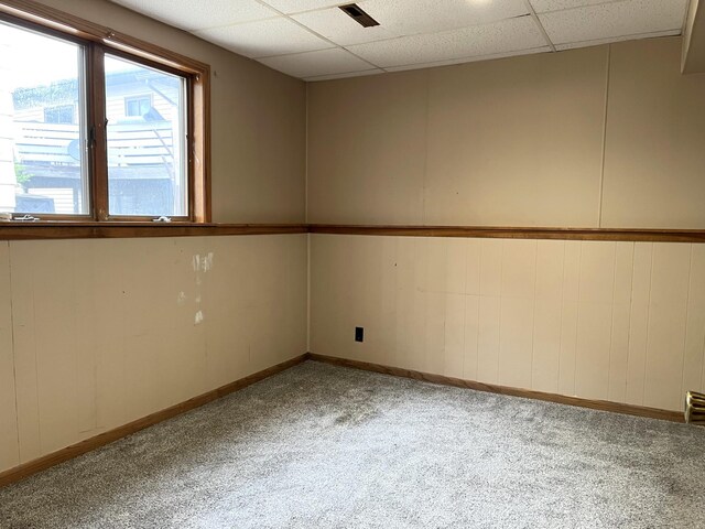 310 8th St, Windom, MN 56101 - carpeted empty room with a drop ceiling and baseboards