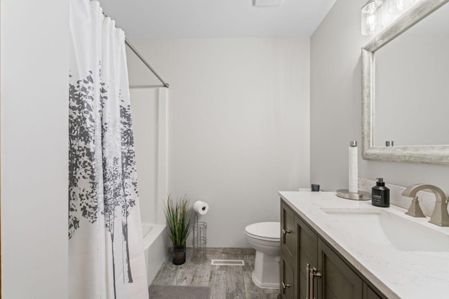 1719 Buckingham Path, Faribault, MN 55021 - full bathroom with vanity, toilet, shower / bath combination with curtain, and wood finished floors