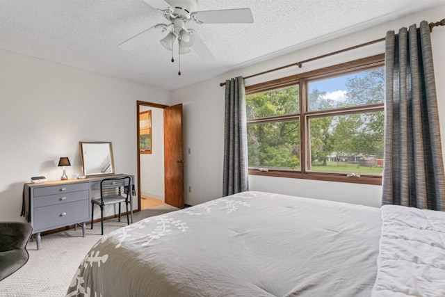 1719 Buckingham Path, Faribault, MN 55021 - carpeted bedroom with a textured ceiling and ceiling fan