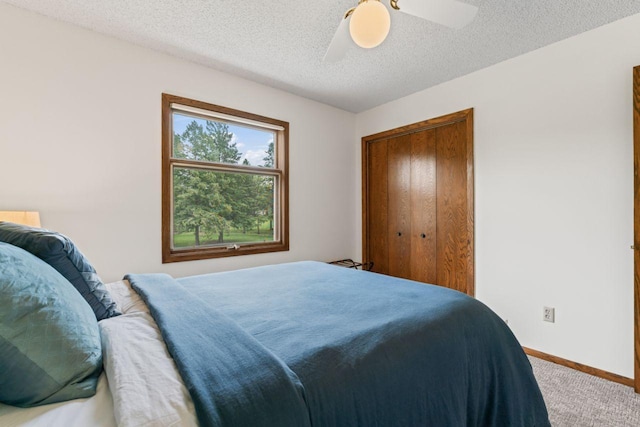 1719 Buckingham Path, Faribault, MN 55021 - carpeted bedroom featuring baseboards, a ceiling fan, and a textured ceiling