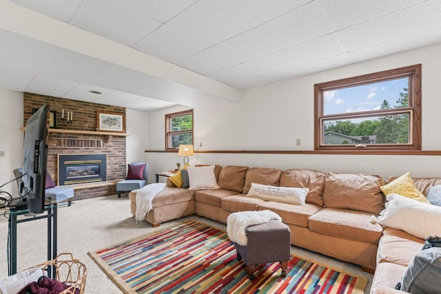 1719 Buckingham Path, Faribault, MN 55021 - carpeted living area with a fireplace and a drop ceiling