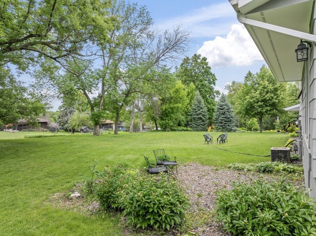 1719 Buckingham Path, Faribault, MN 55021 - view of green lawn with central AC unit
