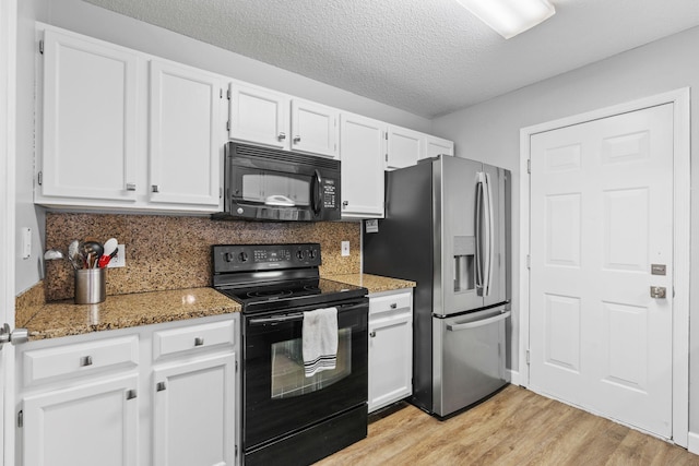 11427 Elmwood Ave N, Champlin, MN 55316 - kitchen with black appliances, white cabinetry, light wood-style floors, light stone countertops, and a textured ceiling