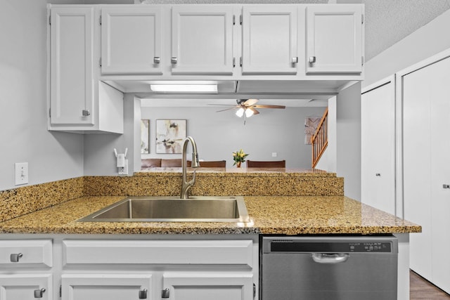 11427 Elmwood Ave N, Champlin, MN 55316 - kitchen with stainless steel dishwasher, ceiling fan, white cabinets, and a peninsula